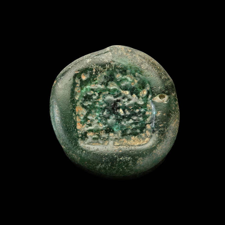 AN EARLY ISLAMIC GLASS WEIGHT OF DOUBLE DIRHAM, 10TH-11TH CENTURY