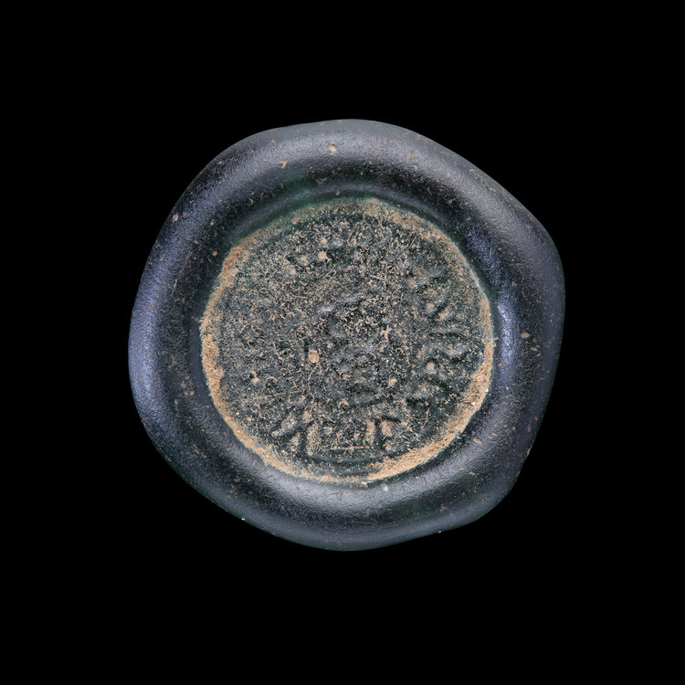 AN EARLY ISLAMIC GLASS WEIGHT OF DIRHAM