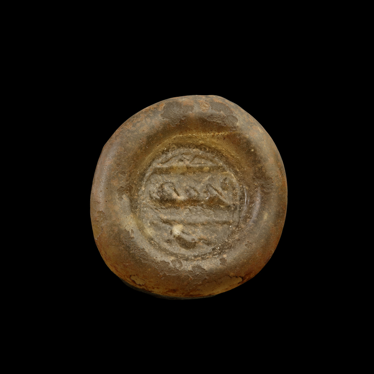 AN EARLY ISLAMIC GLASS WEIGHT OF DOUBLE DIRHAM, 10TH-11TH CENTURY