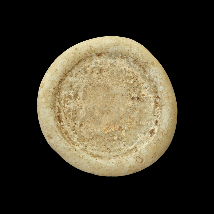 AN ABBASID GLASS WEIGHT OF DIRHAM, BAGHDAD AL-NASIR LI-DIN ALLAH, 576-622 AH/1180-1225 AD