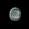 AN EARLY ISLAMIC GLASS WEIGHT OF HALF DIRHAM, 10TH-11TH CENTURY