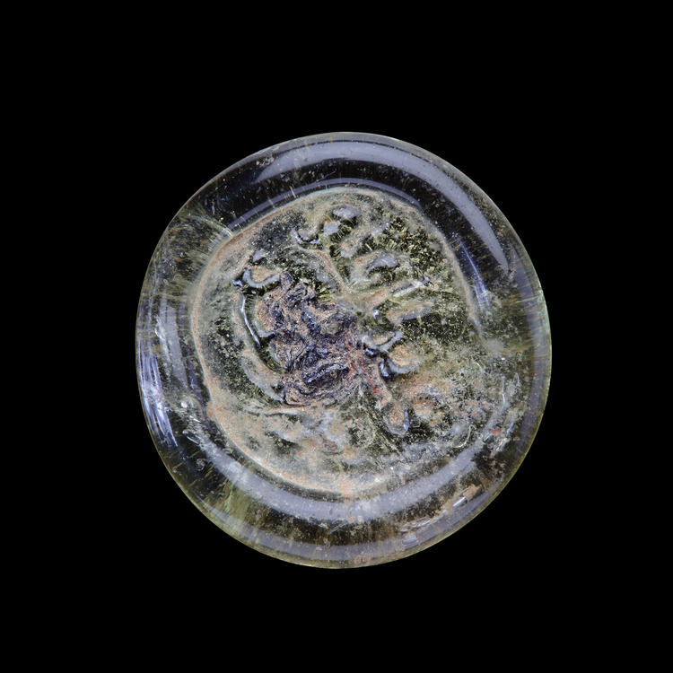AN EARLY ISLAMIC GLASS WEIGHT OF DINAR, 10TH-11TH CENTURY