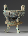 A CHINESE ARCHAIC BRONZE RITUAL FOOD VESSEL (CHANG ZI DING), EARLY WESTERN ZHOU DYNASTY 1046-771 B.C.
