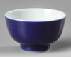 A CHINESE BLUE-GLAZED CUP, 19TH CENTURY