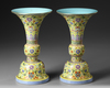 A PAIR OF CHINESE YELLOW-GROUND FAMILLE ROSE GU VASES, QING DYNASTY (1644-1911)