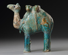 A TURQUOISE GLAZED POTTERY FIGURE OF A CAMEL, KASHAN, PERSIA, 11TH-12TH CENTURY