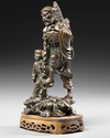 A CHINESE BRONZE FIGURE  OF LOHAN WITH A BOY, 19TH CENTURY