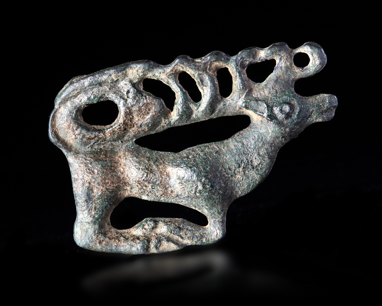 A SCYTHIAN BRONZE APPLIQUE OF A STAG, 600-400 BC