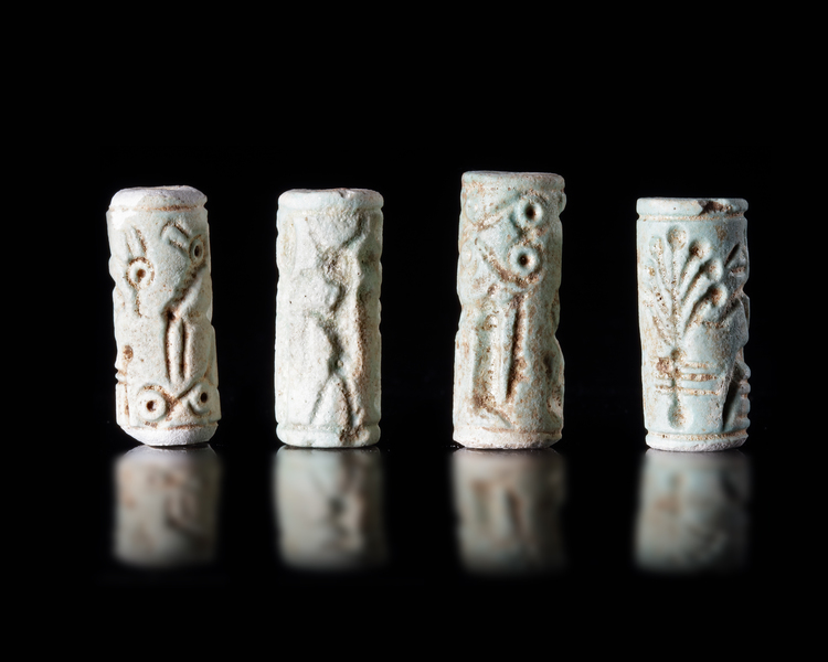 FOUR MITANNIAN FRIT CYLINDER SEALS, CIRCA 1600-1300 BC