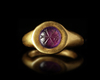 A GOLD RING WITH AN AMETHYST INTAGLIO, 4TH CENTURY AD