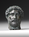 A MINIATURE BRONZE HEAD OF THE EMPEROR HADRIAN, 117-138 AD 2ND CENTURY AD