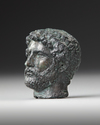 A MINIATURE BRONZE HEAD OF THE EMPEROR HADRIAN, 117-138 AD 2ND CENTURY AD