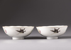 A pair of Chinese famille rose 'butterfly and flower' bowls