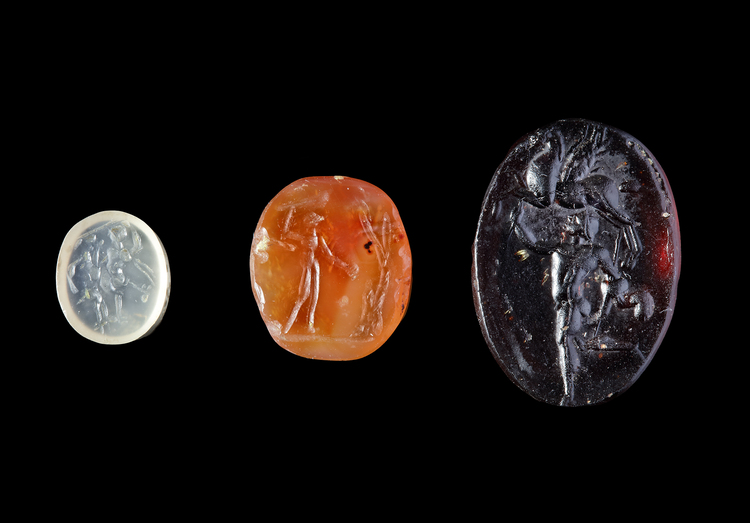 TWO ROMAN INTAGLIOS AND A LATER CAST GLASS IMPRESSION, 2ND CENTURY AD AND 19TH CENTURY AD