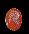 A CARNELIAN INTAGLIO WITH SOL/HELIOS, ROMAN, 1ST CENTURY AD