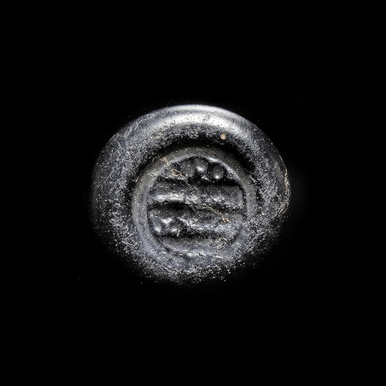AN EARLY ISLAMIC GLASS WEIGHT OF DOUBLE DIRHAM,10TH-11TH CENTURY
