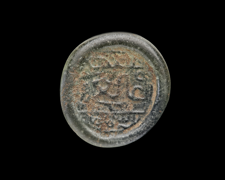 AN EARLY ISLAMIC GLASS WEIGHT OF DIRHAM,10TH-11TH CENTURY