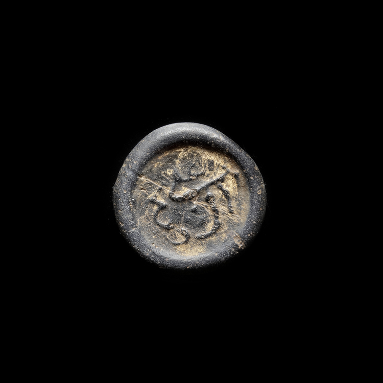 AN EARLY ISLAMIC GLASS WEIGHT OF DIRHAM, 10TH-11TH CENTURY