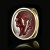 A ROMAN GOLD RING WITH A CARNELIAN INTAGLIO WITH THE PORTRAIT OF A MAN, 1ST BC-AD