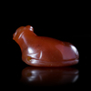 A RECLINING BULL AMULET IN CARNELIAN, EASTERN MEDITERRANEAN, 6TH CENTURY BC