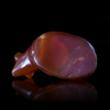 A RECLINING BULL AMULET IN CARNELIAN, EASTERN MEDITERRANEAN, 6TH CENTURY BC
