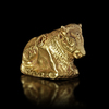 AN EAST GREEK GOLD REPOUSSE RECLINING BULL, 6TH/7TH CENTURY BC