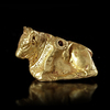 AN EAST GREEK GOLD REPOUSSE RECLINING BULL, 6TH/7TH CENTURY BC
