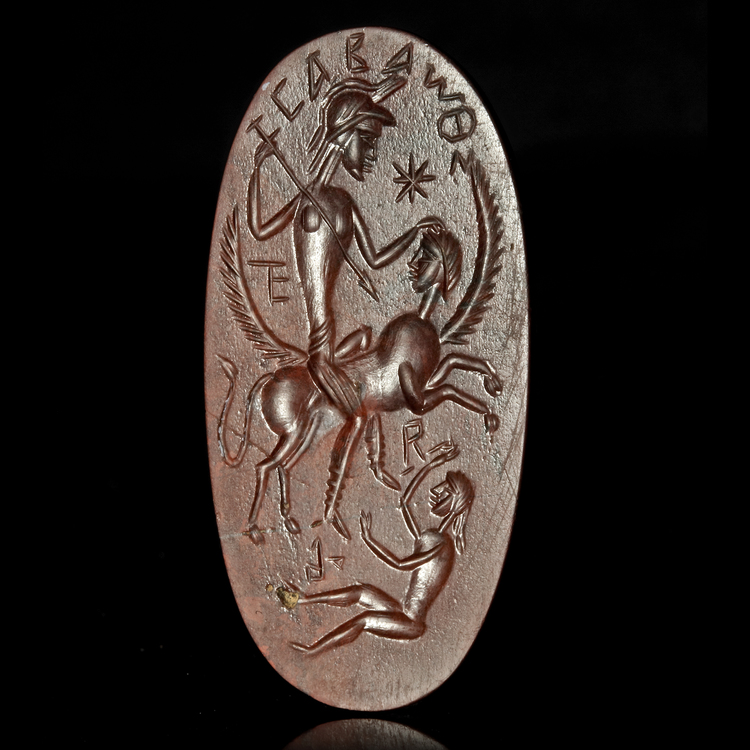A LARGE GNOSTIC SEAL IN DARK RED JASPER, ROMAN, 3RD/4TH CENTURY AD