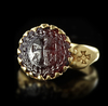 A BYZANTINE GOLD RING SET WITH A GARNET INTAGLIO, 6TH CENTURY AD OR LATER