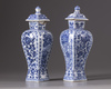 Two Chinese blue and white vases with covers