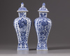 Two Chinese blue and white vases with covers
