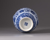 A small blue and white vase