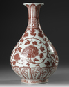 A CHINESE COPPER-RED FLORAL PEAR SHAPED VASE