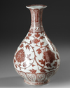A CHINESE COPPER-RED FLORAL PEAR SHAPED VASE