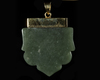 A JADE CARVED TALISMANIC PENDANT