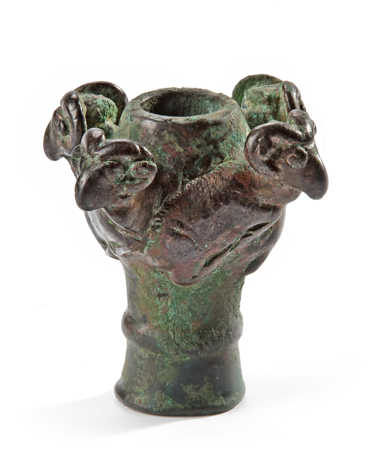 A BRONZE MACE HEAD WITH FOUR RECLINING RAMS, LURISTAN, 10TH-8TH CENTURY BC