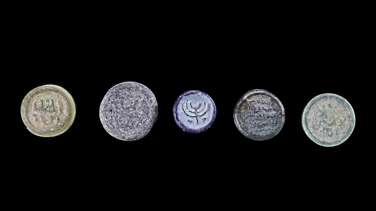 A GROUP OF FIVE MOULDED GLASS WEIGHTS, 8TH-12TH CENTURY