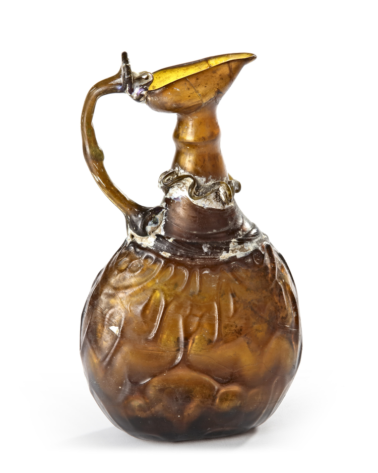 AN AMBER GLASS JUG, PERSIA, 10TH-11TH CENTURY