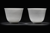 A  PAIR OF SMALL CHINESE WHITE-GLAZED DRAGONS CUPS, 20TH CENTURY