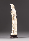 An ivory figure of a lady holding phoenix feathers
