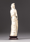 An ivory figure of a lady holding phoenix feathers