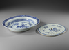 A CHINESE BLUE AND WHITE SERVING PLATTER WITH A STRAINER, 18TH CENTURY