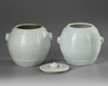 TWO CHINESE BLANC DE CHINE BARREL SHAPED JARS AND A COVER, 18TH CENTURY