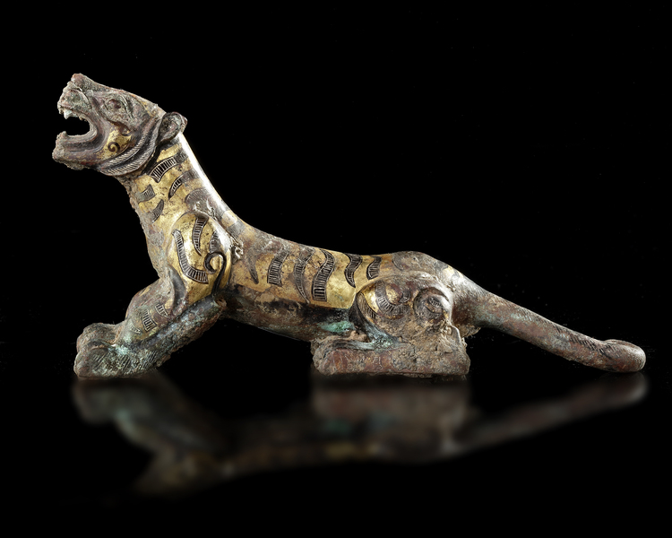 A CHINESE BRONZE 'TIGER' SCROLL WEIGHT, HAN DYNASTY (206 BC-220 AD) OR LATER