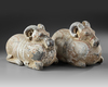 A PAIR OF TERRACOTTA VESSELS IN THE FORM OF A RAM, HAN DYNASTY (206 BC-220 AD)