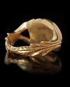 A ROMAN STYLE GOLD RING WITH A GREEN STONE, 3RD-4TH CENTURY AD OR LATER
