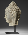 A CHINESE STONE BUDDHA HEAD, 19TH-20TH CENTURY
