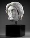 A MARBLE HEAD OF APOLLO, ROMAN 1ST CENTURY AD