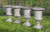 A SET OF FOUR WHITE COMPOSITION STONE GARDEN URNS IN THE ROMANTIC CLASSICAL MANNER, SECOND HALF 20TH CENTURY