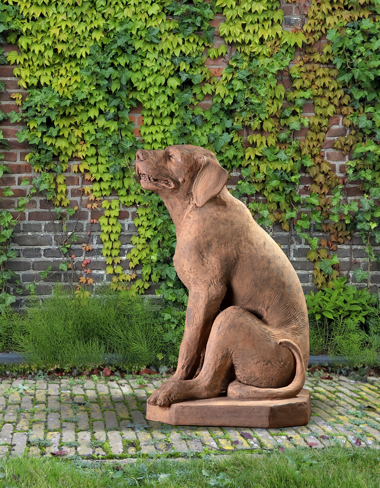 A VENETIAN TERRACOTTA MODEL OF A SEATED HOUND, 19TH CENTURY